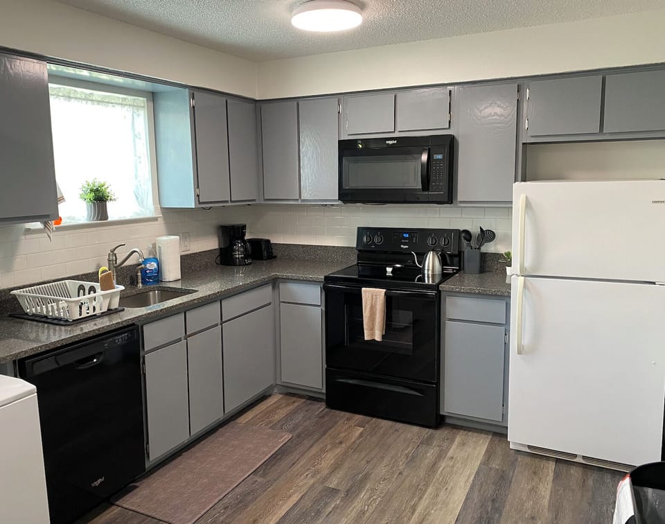 Kitchen essentials include drip coffee maker, kettle, toaster, crockpot, & more.