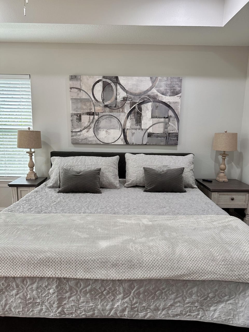 Primary bedroom with king bed, en suite bath, Smart TV, and porch access.