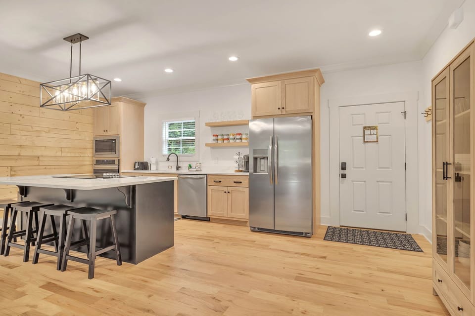 Beautiful gourmet kitchen and front door.