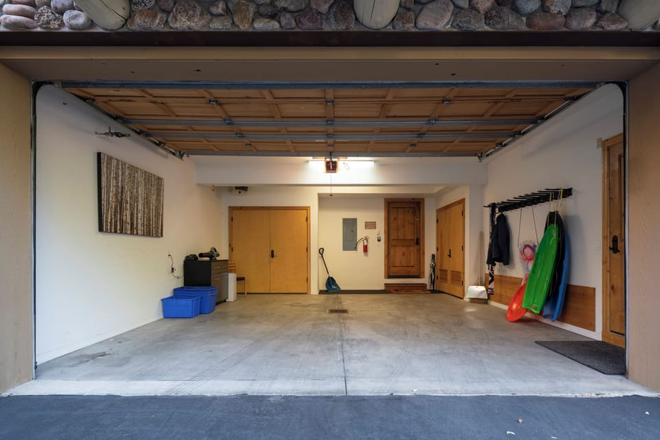 High ceiling garage for large SUV's, sleds for kids to enjoy, ample ski storage
