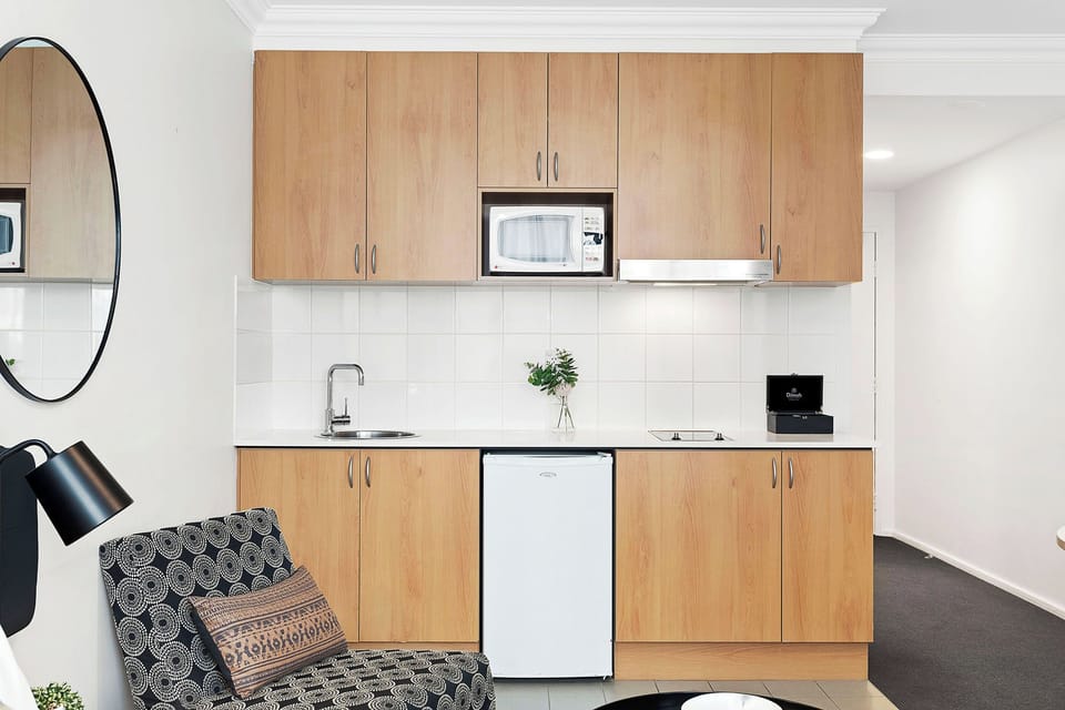 Make yourself at home in this cozy studio apartment, complete with a kitchenette for whipping up quick meals.