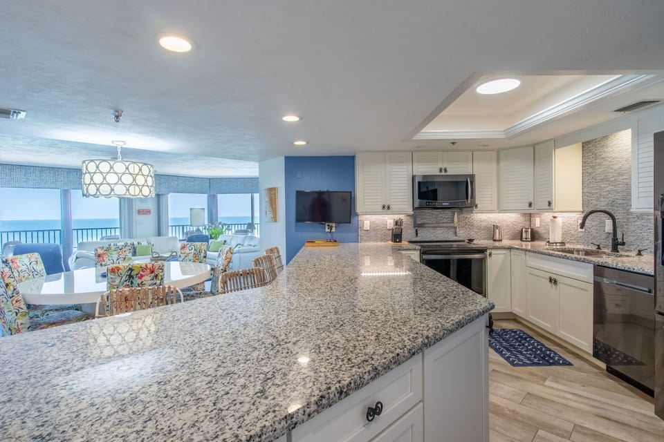 Updated kitchen complete with full size appliances, granite countertops & a view