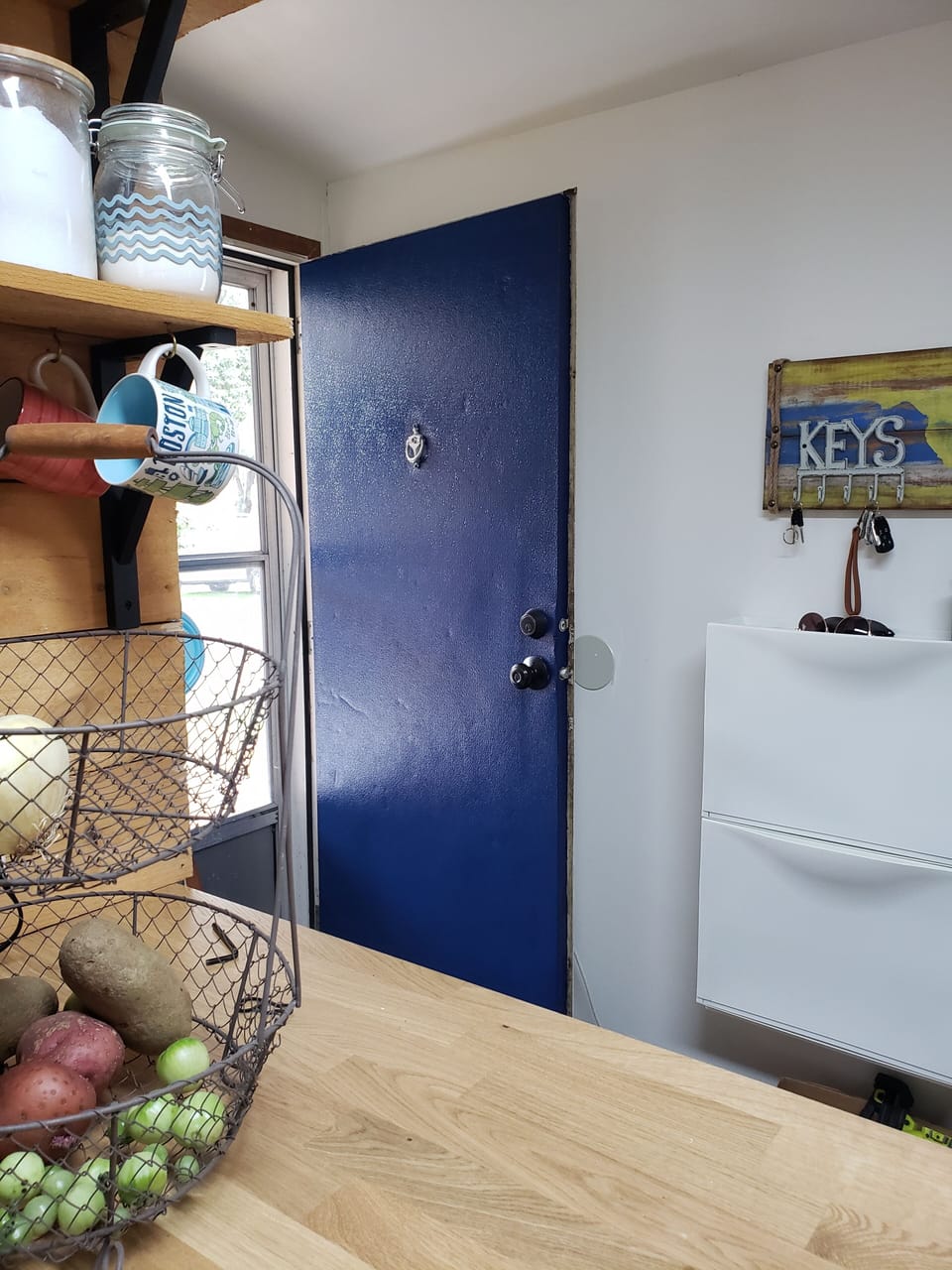 Front entry with shoe storage. 
