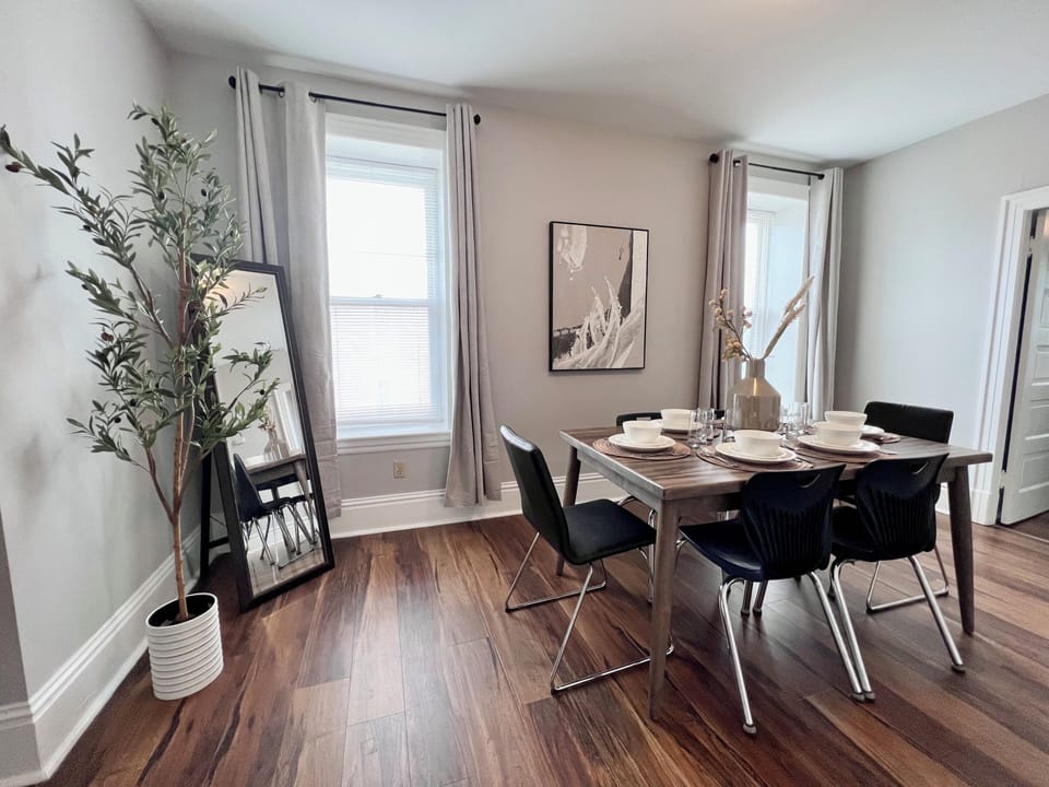 Large dining area with seating for 6 and standup mirror