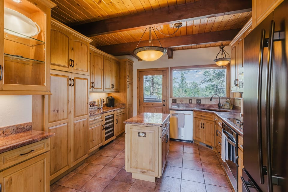 Rustic charm meets modern convenience in this fully equipped kitchen.