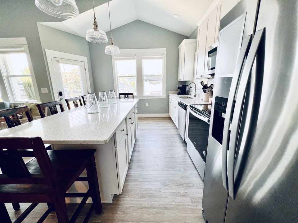 Create culinary magic in this beautifully stocked, white-themed kitchen.