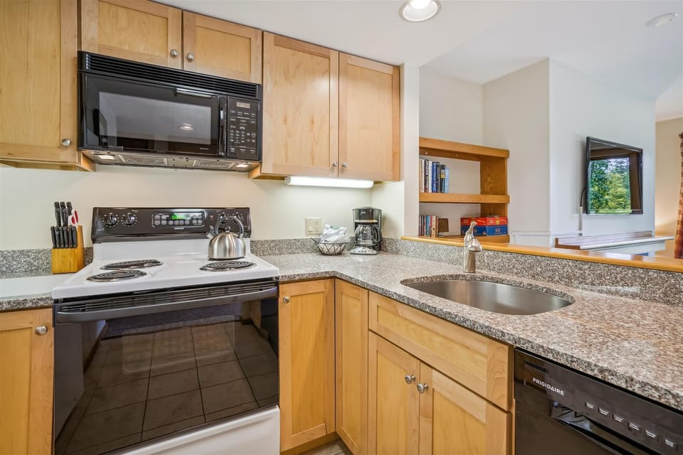 Updated Modern Kitchen, plenty of counter space.  Easy access while you cook your meals and entertain guests or family.