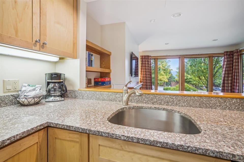 Upgraded counter tops.  Open view to the living room.