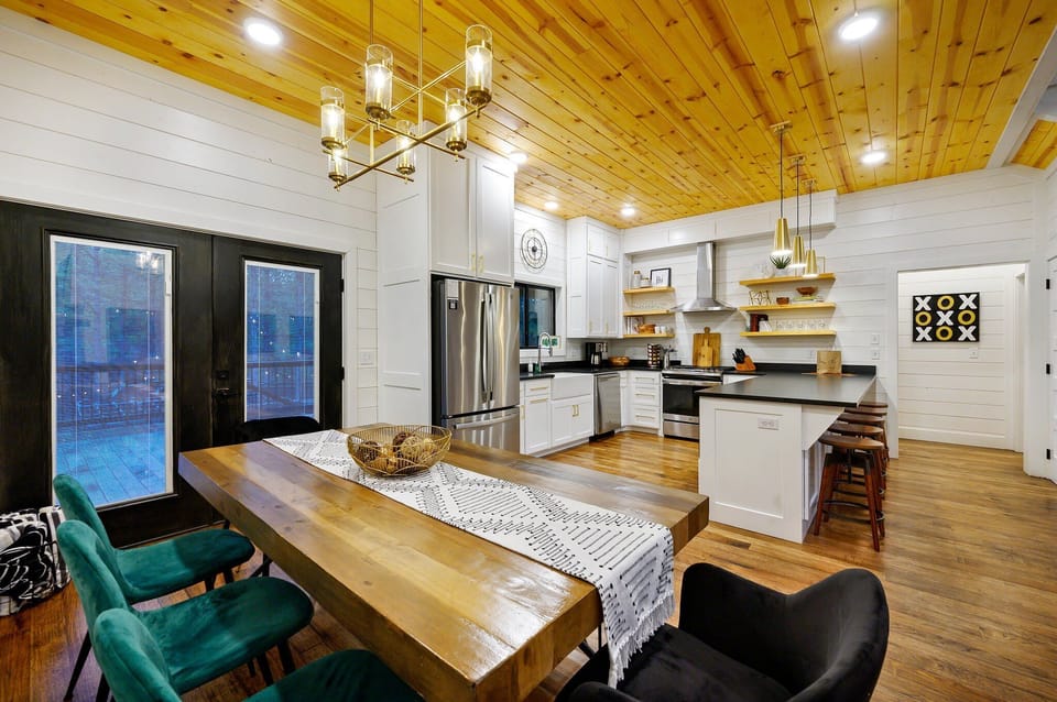 The living room seamlessly flows into the kitchen/dining area.