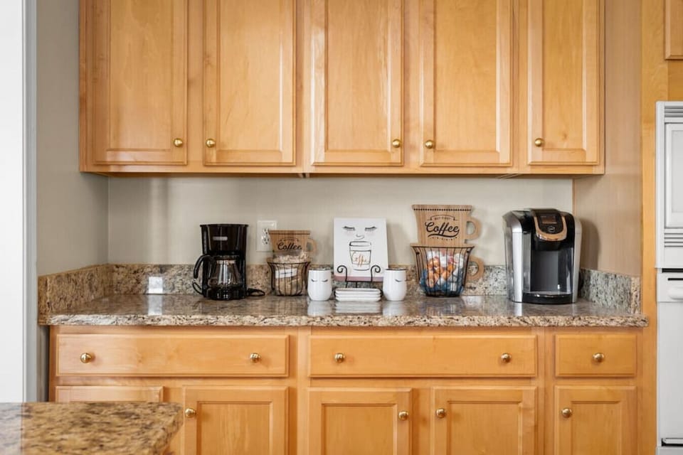 Cozy Coffee Station featuring both a Keurig coffee maker and a classic drip coffee maker – perfect for brewing your favorite cup, your way!
