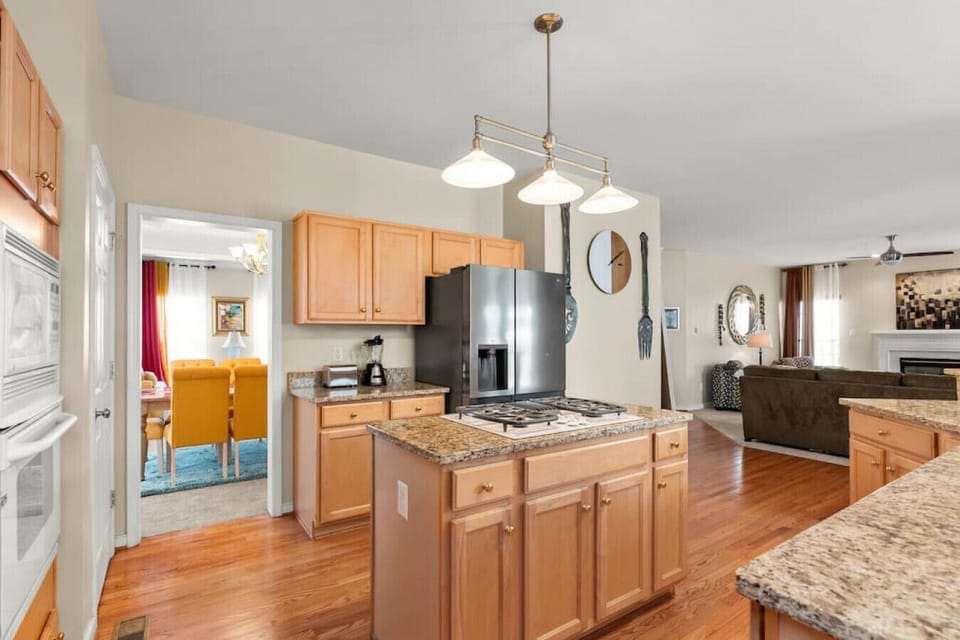This well-appointed kitchen boasts a gas stove, oven, fridge, freezer, and dishwasher. A kitchen island with a built-in stovetop provides ample prep space, while the coffee nook ensures your mornings start right!