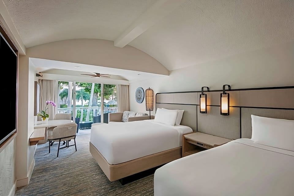 Settle in comfortably with two plush beds and balcony breezes.