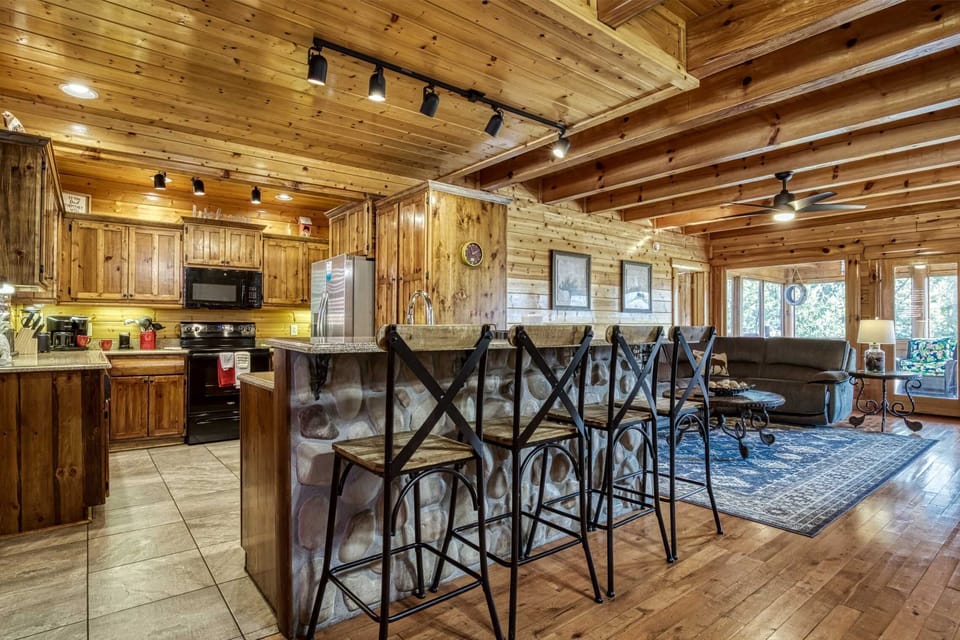 Enjoy culinary adventures in this charming wood-accented kitchen with stylish decor!