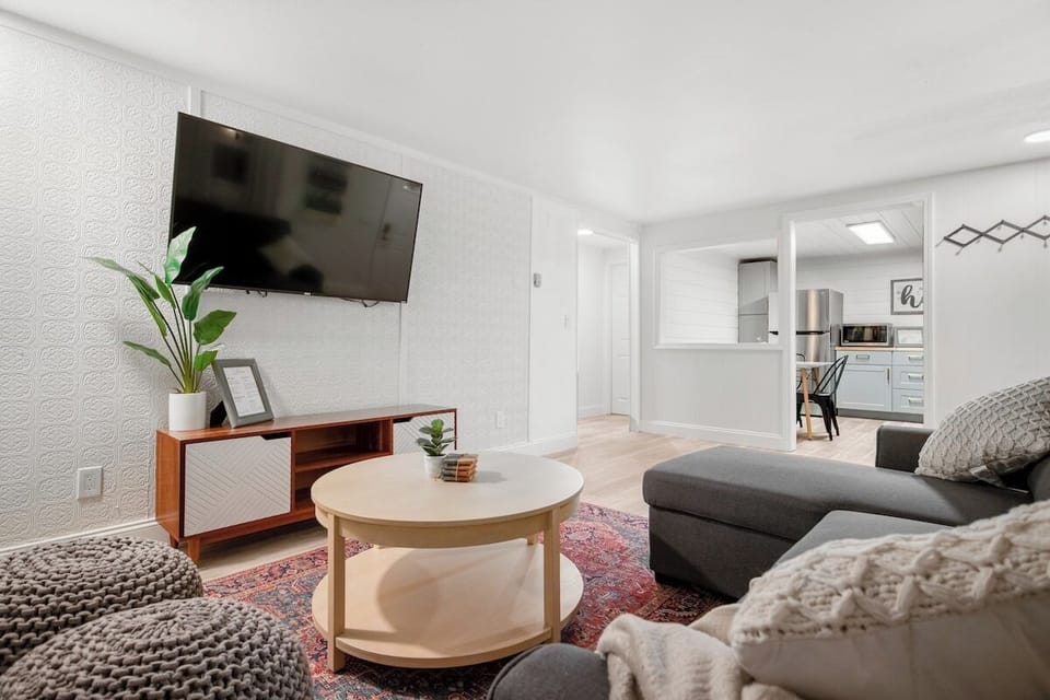Open living area has one sofa bed. Opens to kitchen and eating area. 