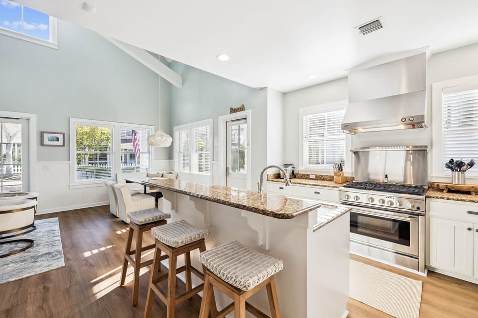 Cook your favorite meals in this bright kitchen with granite counters, stainless appliances, and island seating for casual dining together.