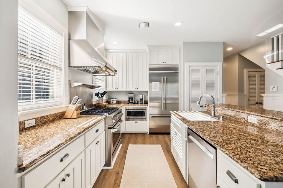 Whip up culinary masterpieces in your fully equipped gourmet kitchen with granite counters, stainless steel appliances, and ample prep space.