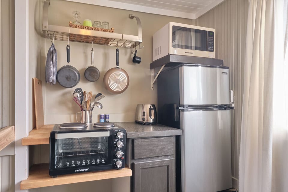 Fully stocked kitchen including toaster oven with two top burner