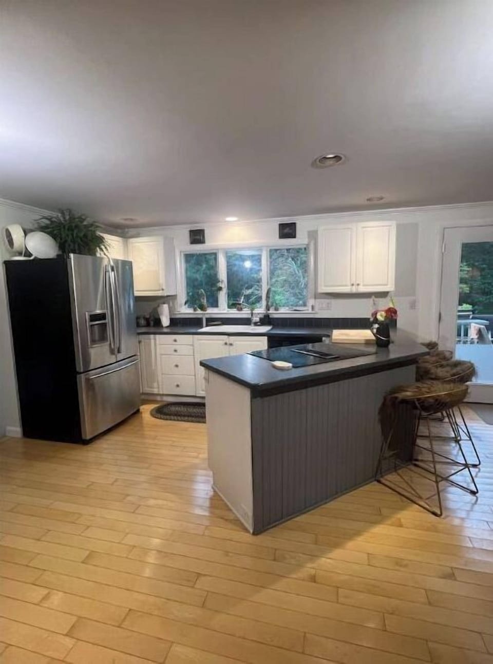 Kitchen leads down to the butler's pantry, a half bath and a laundry room. 