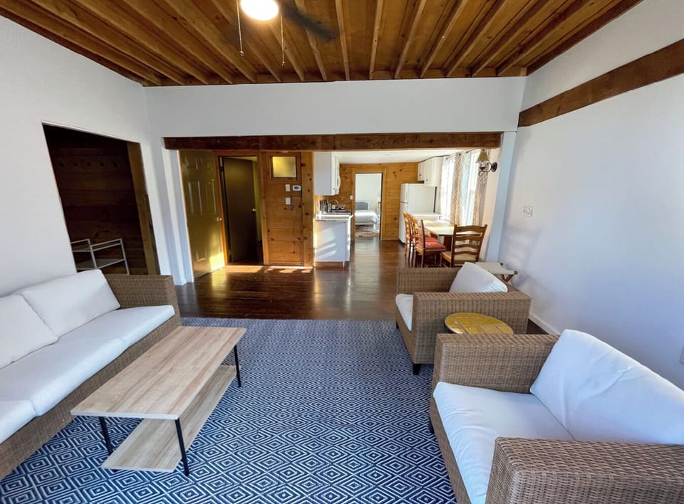 2Bdr living room into master bedroom from deck's sliding door. Kids room is left off the living