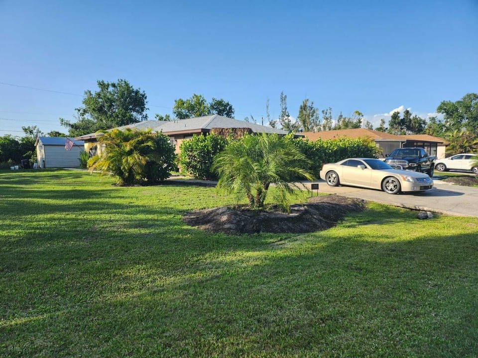 External view across lawn to house