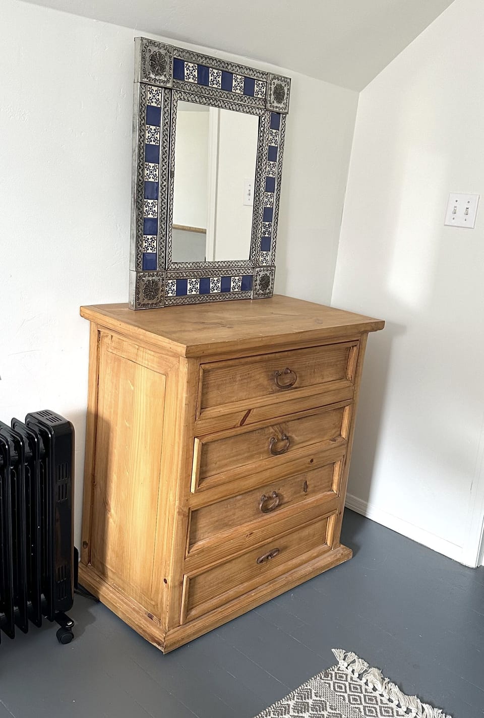 Dresser in twin bedroom for clothing storage