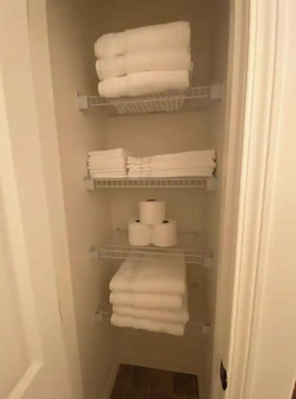 Basement full bathroom linen closet with extra towels.