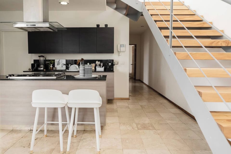 Cooking and eating space with stair to go second floor