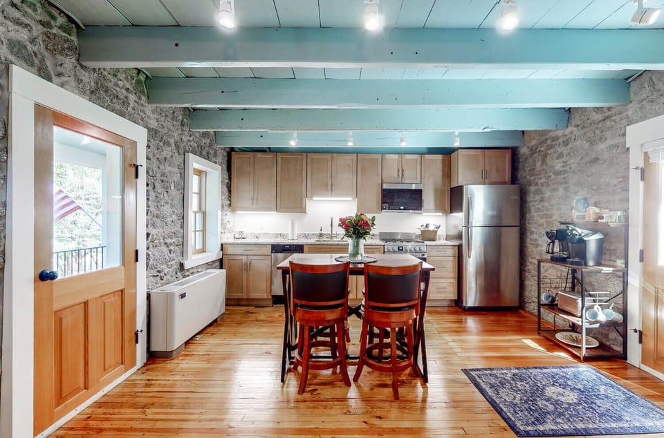 Kitchen - Floor mounted mini split on the left and coffee bar on the right. 