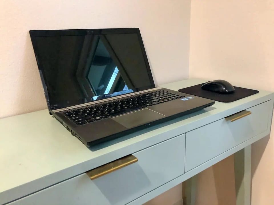 Private work space with desk in bedroom