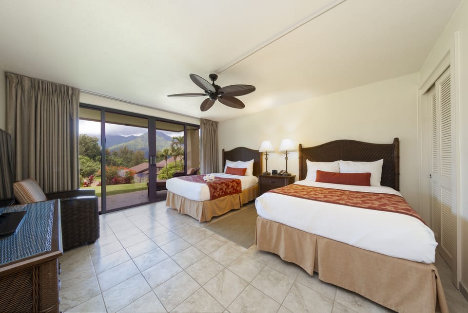 Unwind in crisp beds with garden-facing sliding doors.