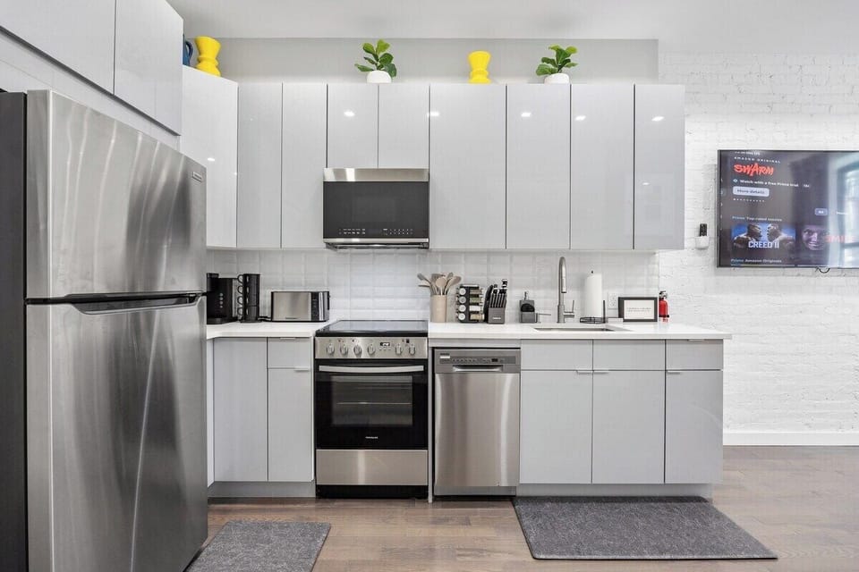 Prepare culinary masterpieces in this sleek and fully-equipped kitchen, where inspiration and flavors come to life.