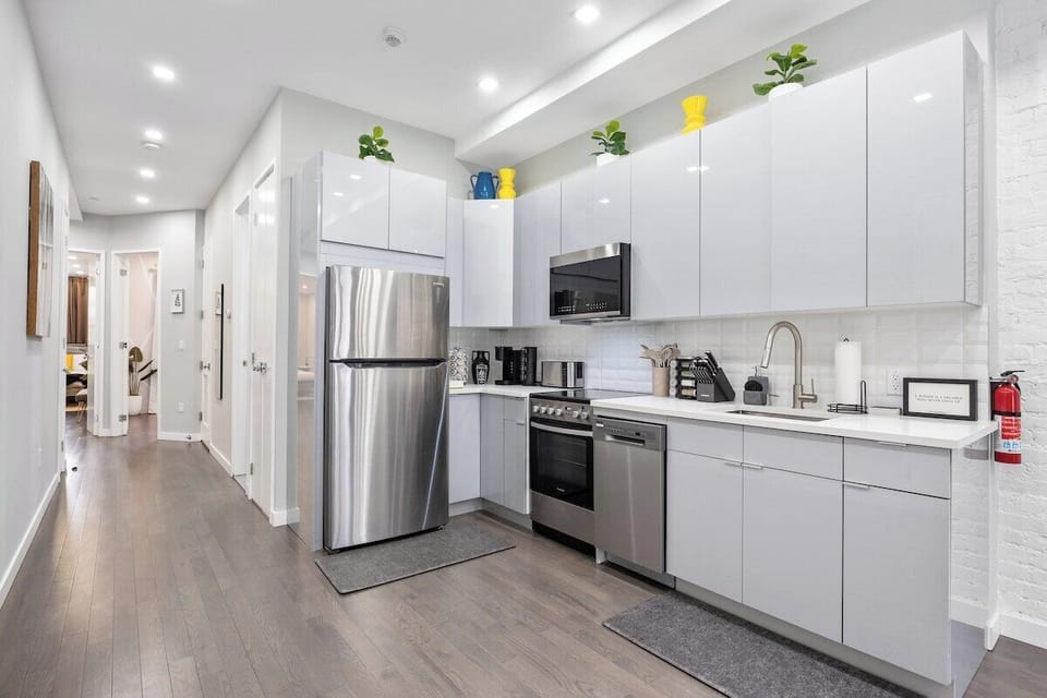 Prepare culinary masterpieces in this sleek and fully-equipped kitchen, where inspiration and flavors come to life.
