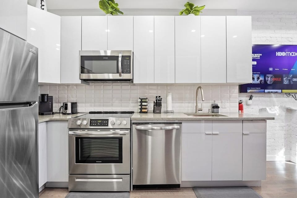Prepare culinary masterpieces in this sleek and fully-equipped kitchen, where inspiration and flavors come to life.
