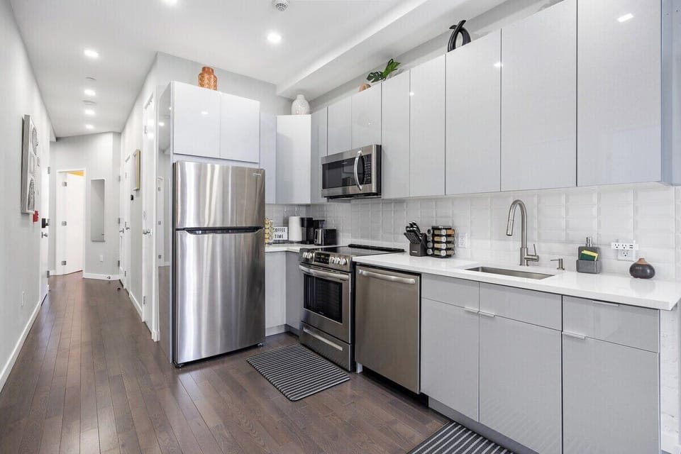 Prepare culinary masterpieces in this sleek and fully-equipped kitchen, where inspiration and flavors come to life.