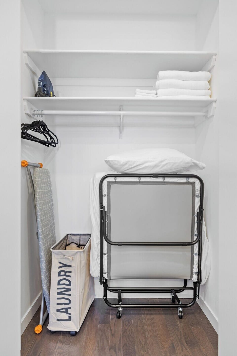 Thoughtful comforts at every corner: discover the convenience of an extra bed, well-stocked hangers, fresh sheets, a laundry basket, iron, and ironing board, ensuring a seamless stay with all your needs met.