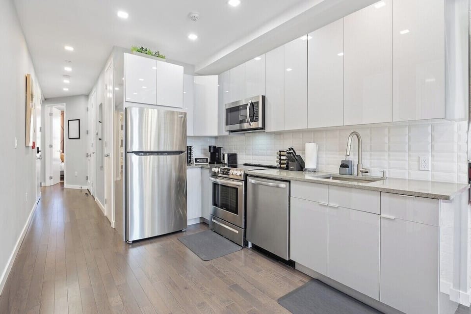 Prepare culinary masterpieces in this sleek and fully-equipped kitchen, where inspiration and flavors come to life.