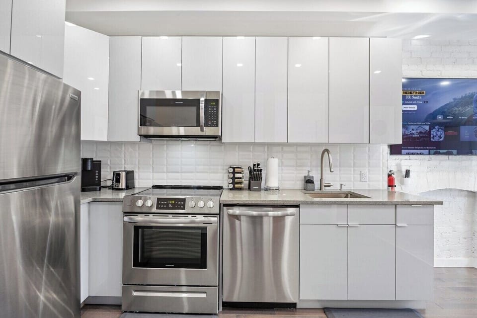 Prepare culinary masterpieces in this sleek and fully-equipped kitchen, where inspiration and flavors come to life.
