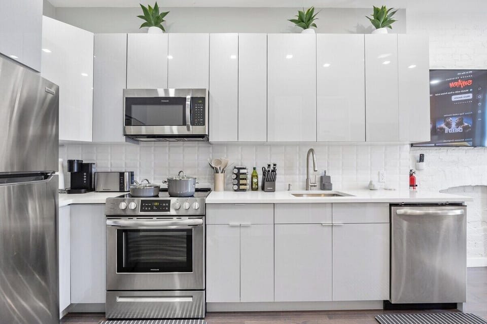 Prepare culinary masterpieces in this sleek and fully-equipped kitchen, where inspiration and flavors come to life.