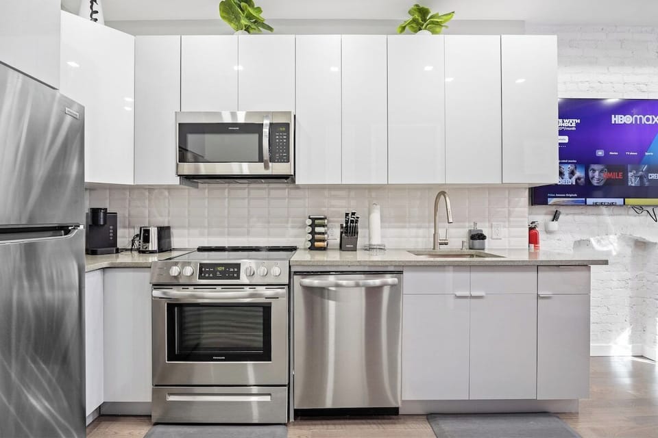 Prepare culinary masterpieces in this sleek and fully-equipped kitchen, where inspiration and flavors come to life.