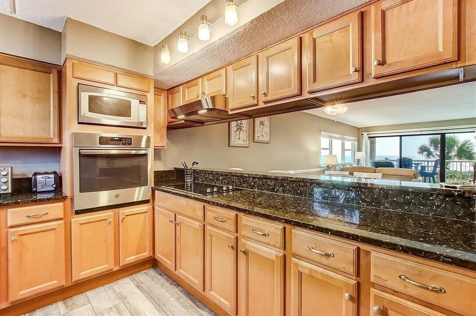 Fully Equipped Kitchen with Granite Countertops and Stainless Appliances and Drip Coffeemaker