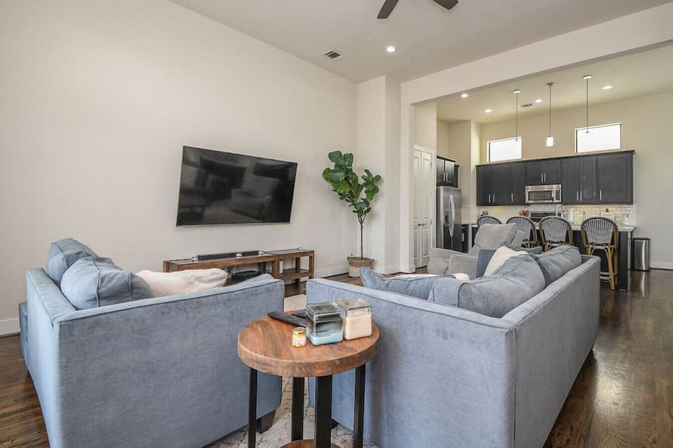 Spacious living room with large flat screen smart TV