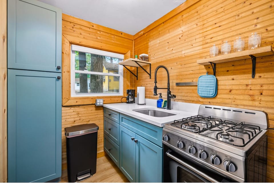 Kitchen: Whip up delicious meals in this stylish, well-equipped kitchen with charming wooden accents!
