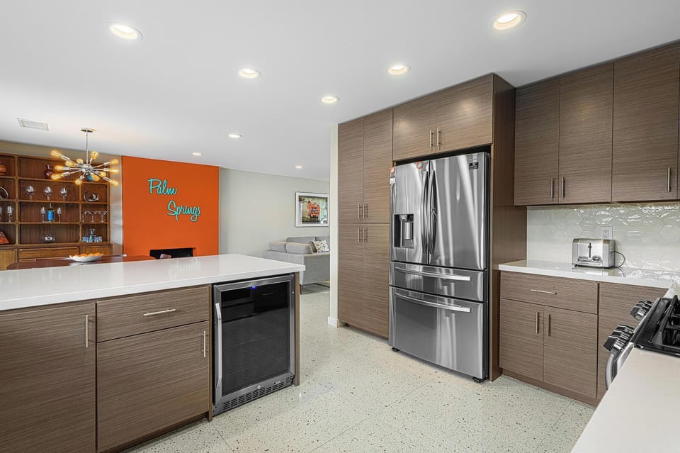 Stainless steal appliances include beverage fridge & French door fridge/freezer