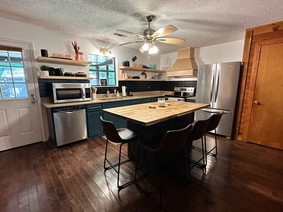 Fully stocked kitchen with bar seating