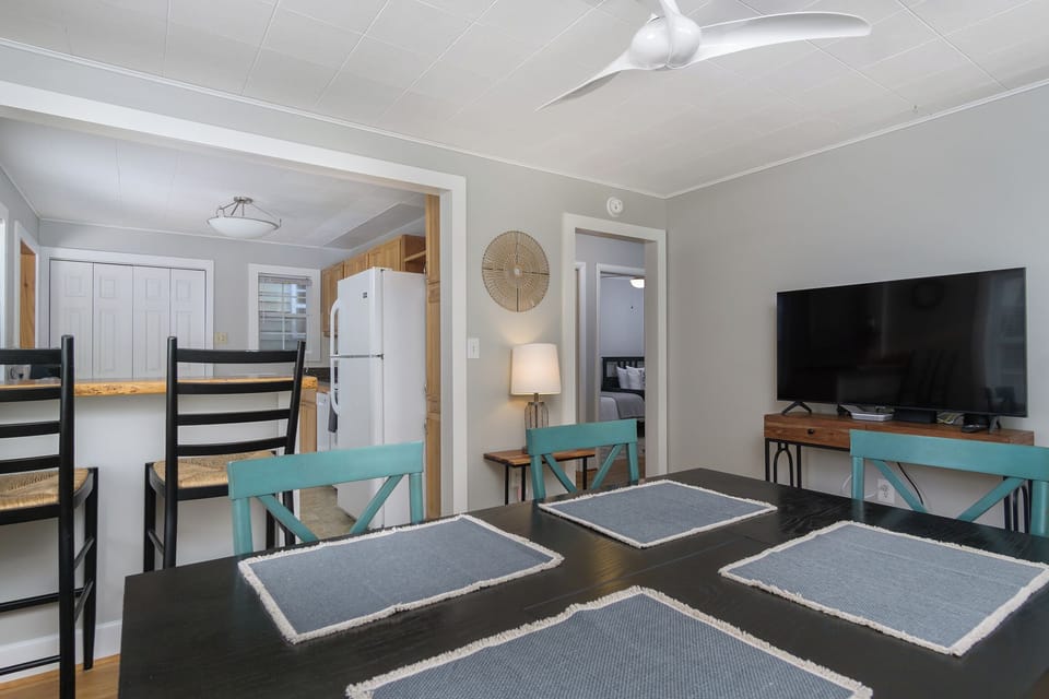 Dining area with seating for up to 6 & 50" smart TV (streaming only).