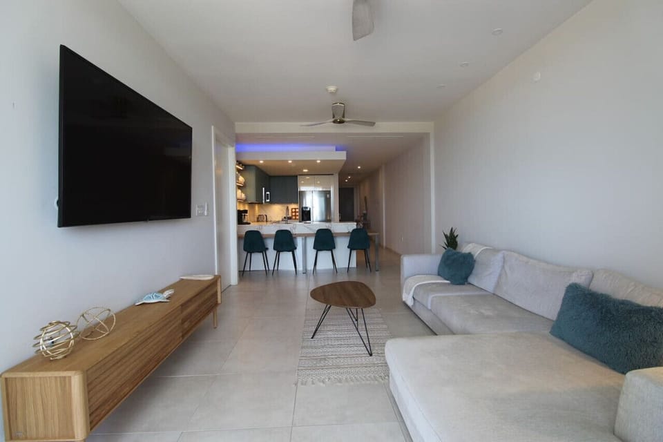 In this elegant environment, take a seat on the plush sofa for a relaxed movie night.