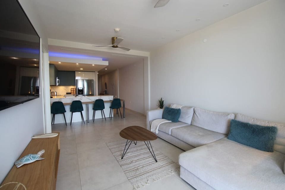 With an open concept modern living room, enjoy the beautiful ocean view from any angle.