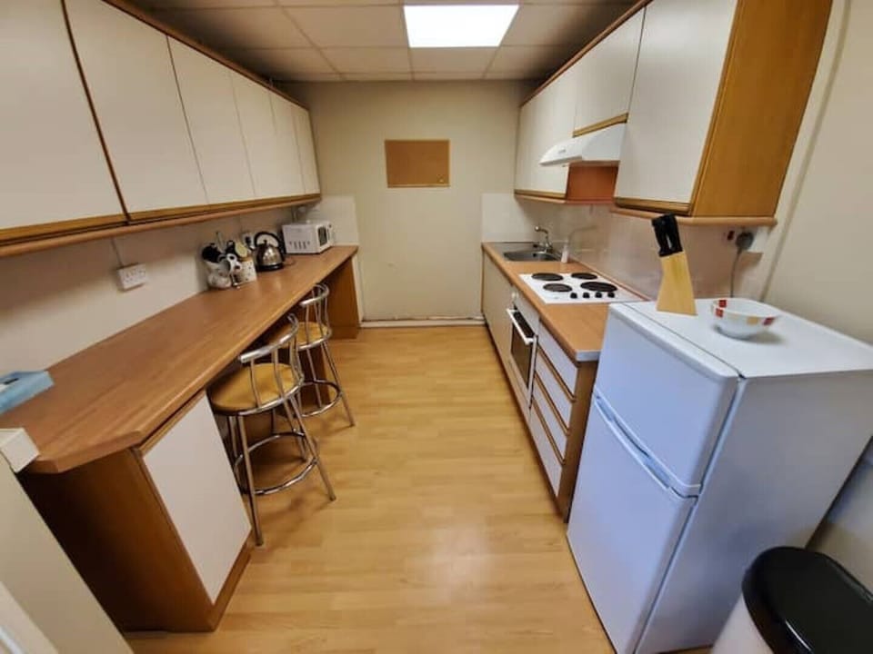 Full kitchen with oven, microwave and full size fridge/freezer (not shown)
