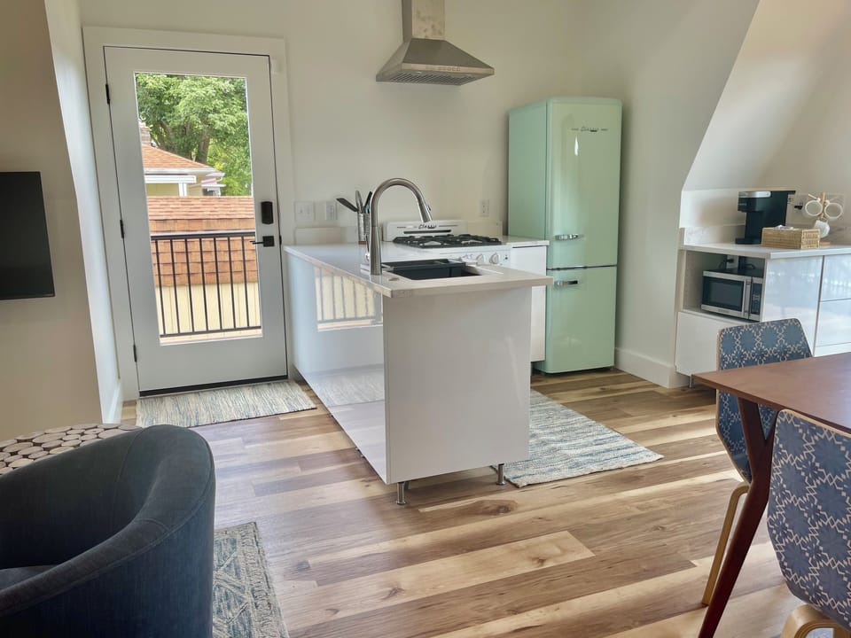 Kitchen includes refrigerator/freezer, gas range, microwave, garbage disposal