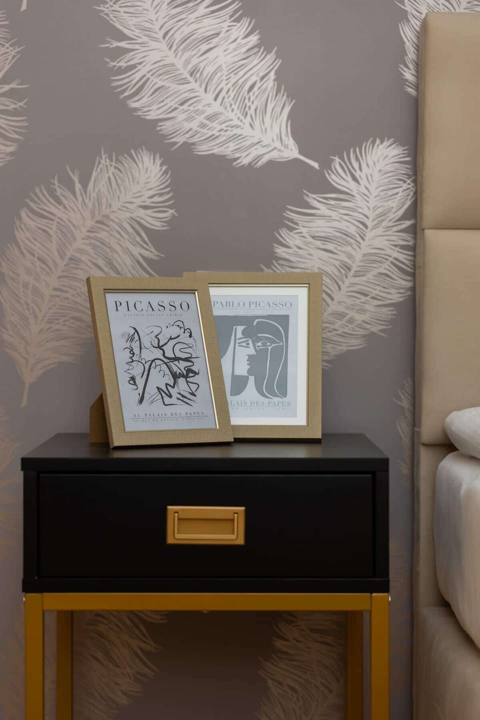 A final angle of the bedroom, showcasing the stylish wallpaper and thoughtfully curated décor.







